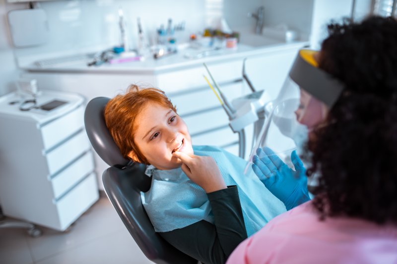 child preparing for tooth extraction